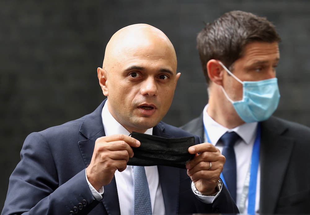Britainu00e2u20acu2122s new Health Secretary Sajid Javid holds a face mask, as he leaves the Downing Street in London, Britain, June 30, 2021. u00e2u20acu201d Reuters picnnn