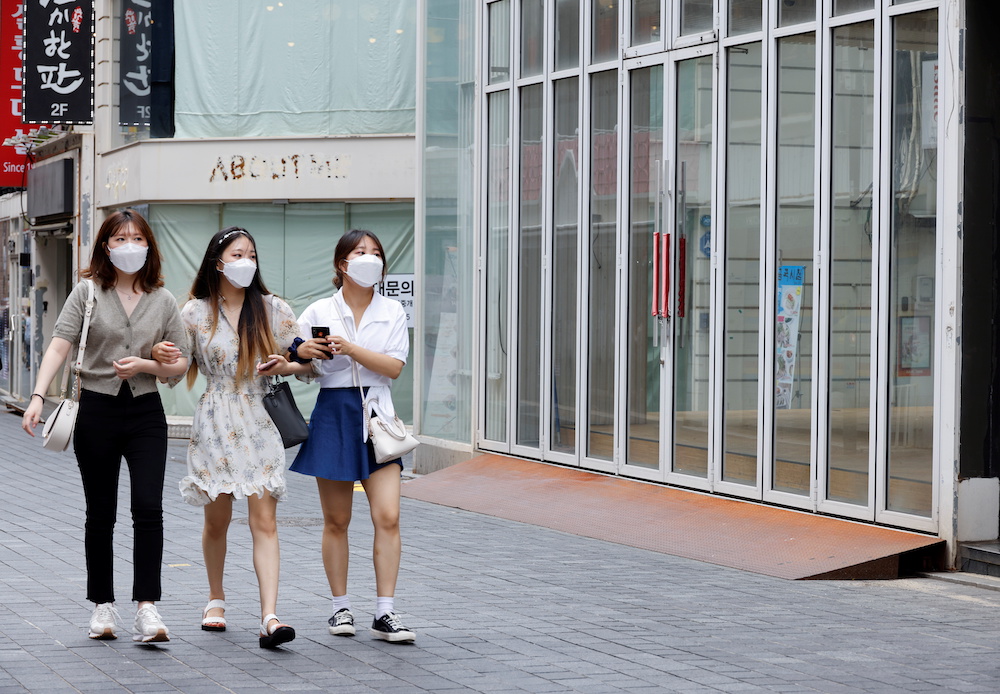 Women wearing masks walk in a shopping district amid the Covid-19 pandemic in Seoul, South Korea, July 9, 2021. u00e2u20acu201d ETX Studio pic