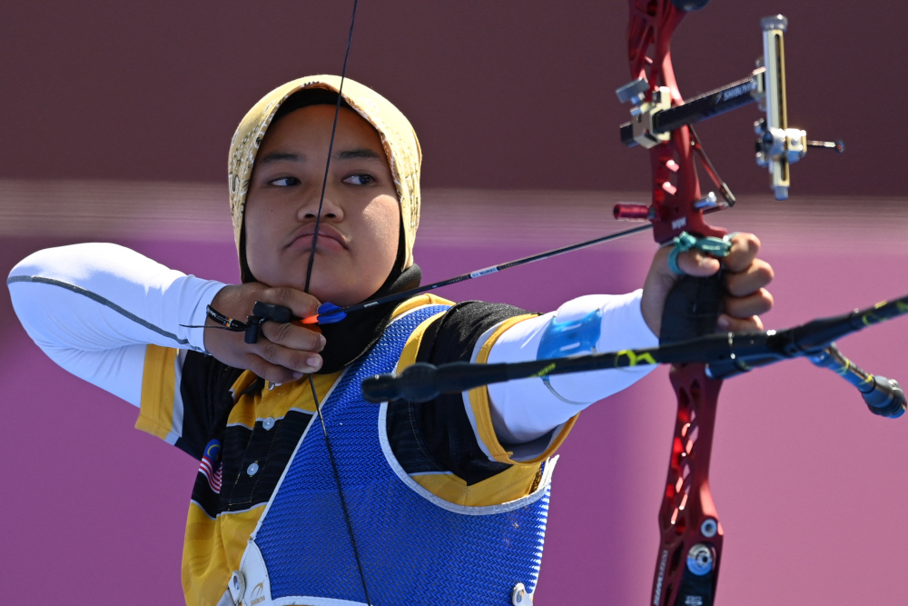 Malaysiau00e2u20acu2122s Syaqiera Mashayikh competes in the womensu00e2u20acu2122s individual eliminations during the Tokyo 2020 Olympic Games at Yumenoshima Park Archery Field in Tokyo July 27, 2021. u00e2u20acu201d AFP picnn