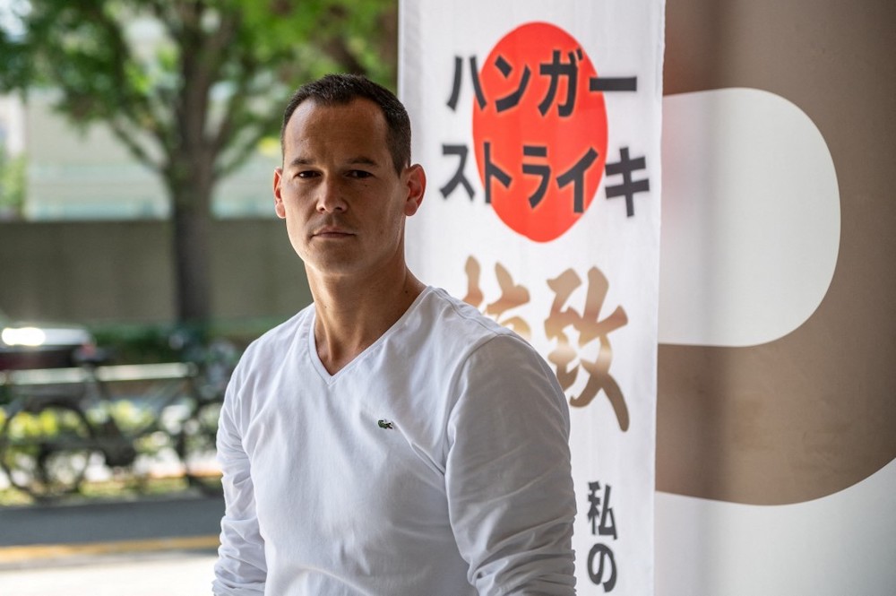 French resident Vincent Fichot, whose two children have been abducted by their Japanese mother, poses for a photo following an interview with AFP about his hunger strike outside a train station in Tokyo on July 10, 2021. u00e2u20acu201d Reuters pic