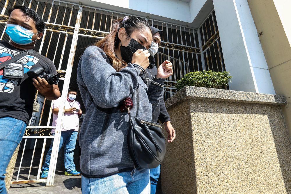 Indonesian Zhiehara Toding arrives at the George Town Magistrateu00e2u20acu2122s Court to face charges of owning and using a fake identity card on July 22, 2021. u00e2u20acu201d Picture by Sayuti Zainudin