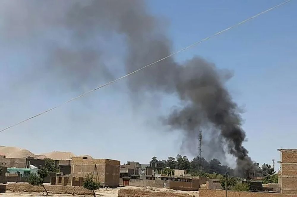A smoke plume rises from houses as clashes rage between Afghan security forces and Taliban fighters in the western city of Qala-i-Naw in Afghanistan. u00e2u20acu201d AFP pic