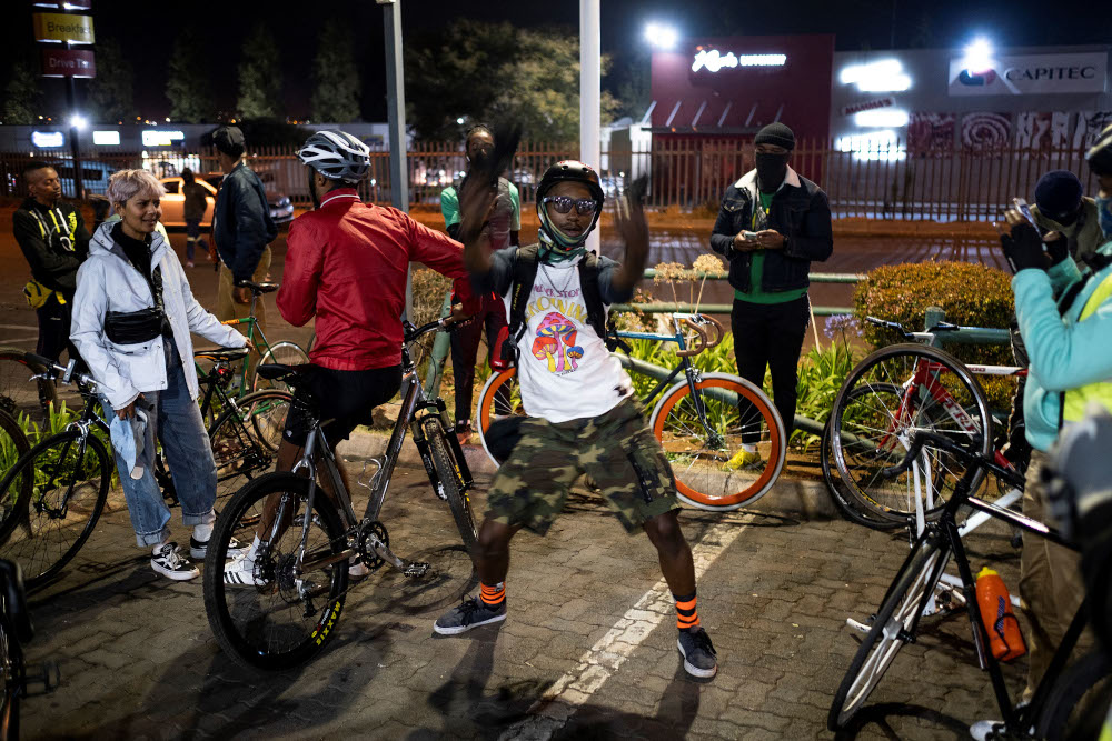 A member of the Biking Bandits dances while they take a break during the u00e2u20acu02dcHomies Night Rideu00e2u20acu2122 in Soweto. u00e2u20acu201d AFP pic