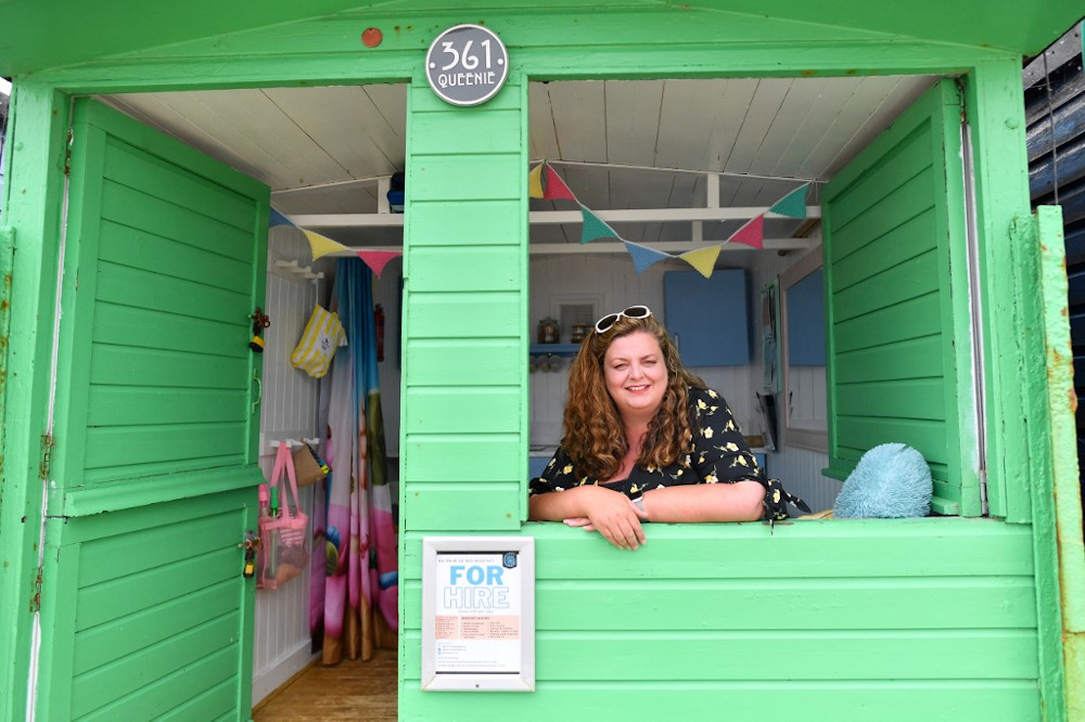 Owner of rental business Walton-on-the-Naze beach huts, Sarah Stimson sits inside her family’s beach hut at Walton-on-the-Naze on July 15, 2021. — AFP pic