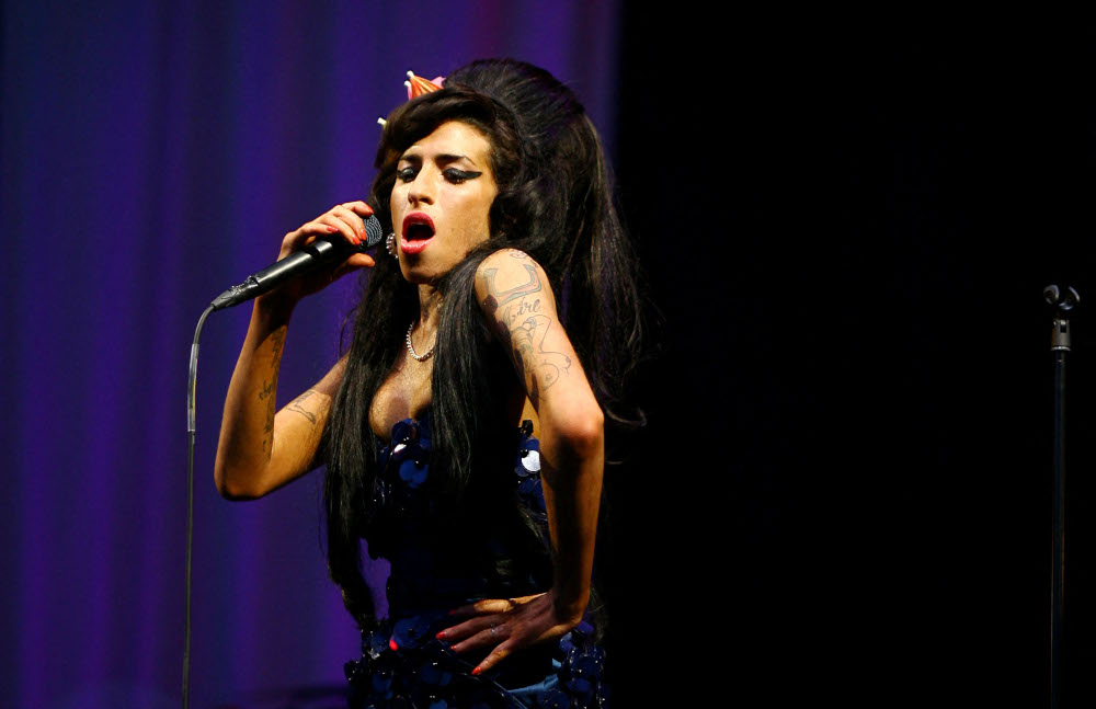 In this file photo taken June 28, 2008 British singer Amy Winehouse performs at the Glastonbury Festival at Worthy Farm, in Glastonbury. u00e2u20acu201d AFP picnn