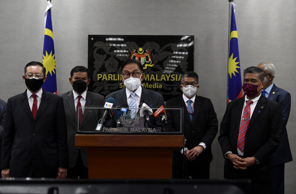 Opposition Leader Datuk Seri Anwar Ibrahim with Bagan MP Lim Guan Eng and Kota Raja MP Mohamad Sabu during a press conference in Parliament lobby, July 29, 2021. u00e2u20acu201d Bernama pic 