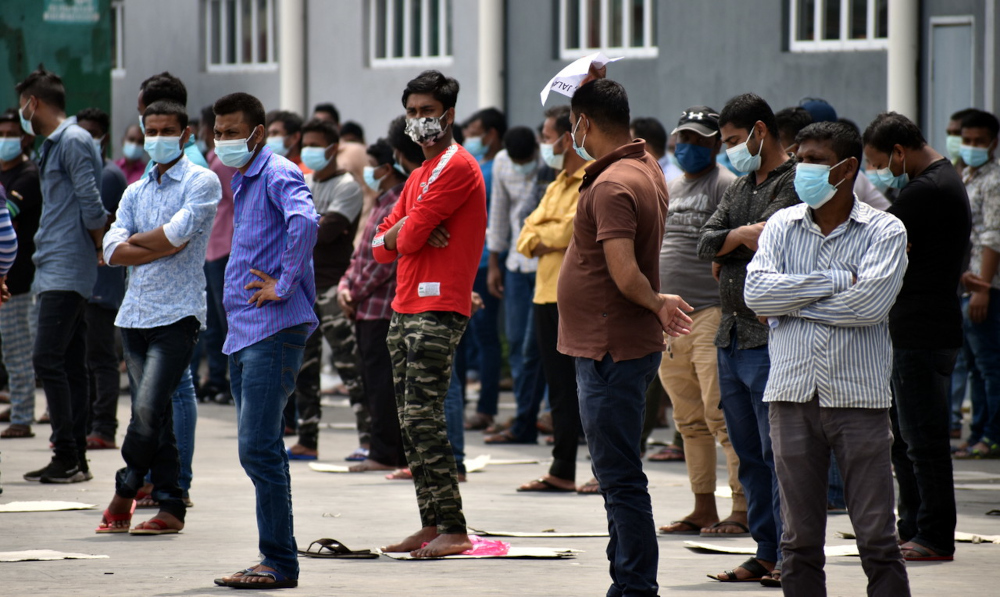 Foreign workers at a factory in the Ayer Keroh Industrial Area wait to get swabbed for Covid-19 in Melaka, July 8, 2021. u00e2u20acu201d Bernama pic  