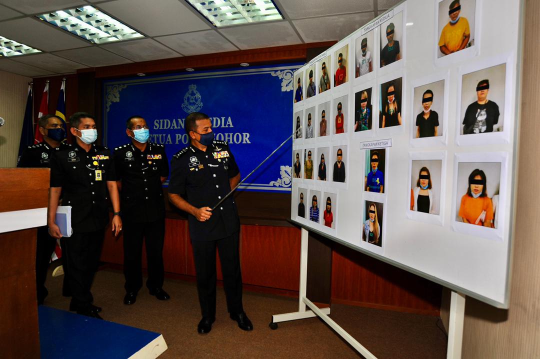 Johor police chief Datuk Ayob Khan Mydin Pitchay shows a chart of members in the prostitution syndicate arrested at the Johor police contingent headquarters in Johor Baru July 12, 2021. u00e2u20acu201d Picture by Ben Tan 