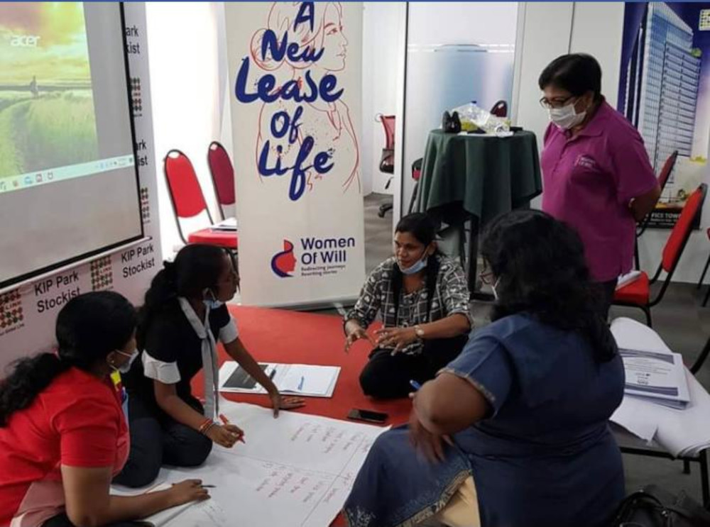 Trainers teaching the women how to adapt their businesses online and how to market their products.