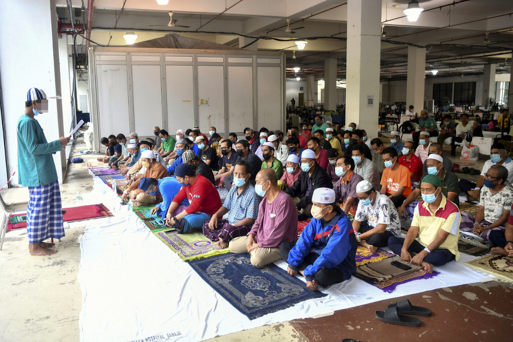 An imam leads Aidiladha prayers at the Covid-19 Low-Risk Quarantine and Treatment Centre at the Malaysia Agriculture Expo Park 2 in Serdang on Hari Raya Aidiladha July 20, 2021. u00e2u20acu201d Bernama pic