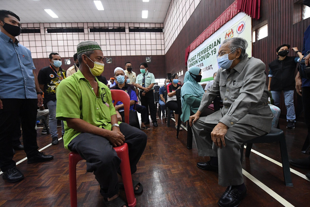 Former Prime Minister Tun Mahathir Mohamad having a light moment with the society during his survey at the Assyifa Padang Mat Sirat Hall in Langkawi June 23, 2021. u00e2u20acu201d Bernama pic