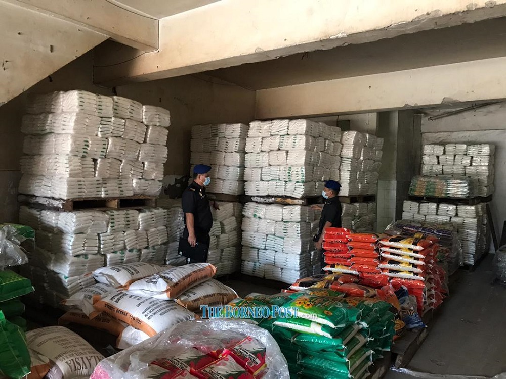 KPDNHEP enforcement personnel check supplies of essential goods at a premises. u00e2u20acu201d Borneo Post Online pic