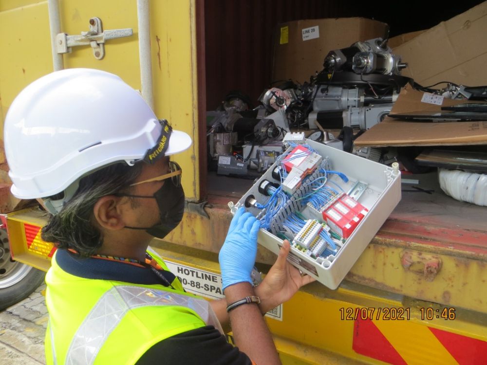 Department of Environment officers found e-waste inside a container that was illegally brought into the country and have issued an order to have the container sent back to its country of origin. u00e2u20acu201d Picture courtesy of the DoE