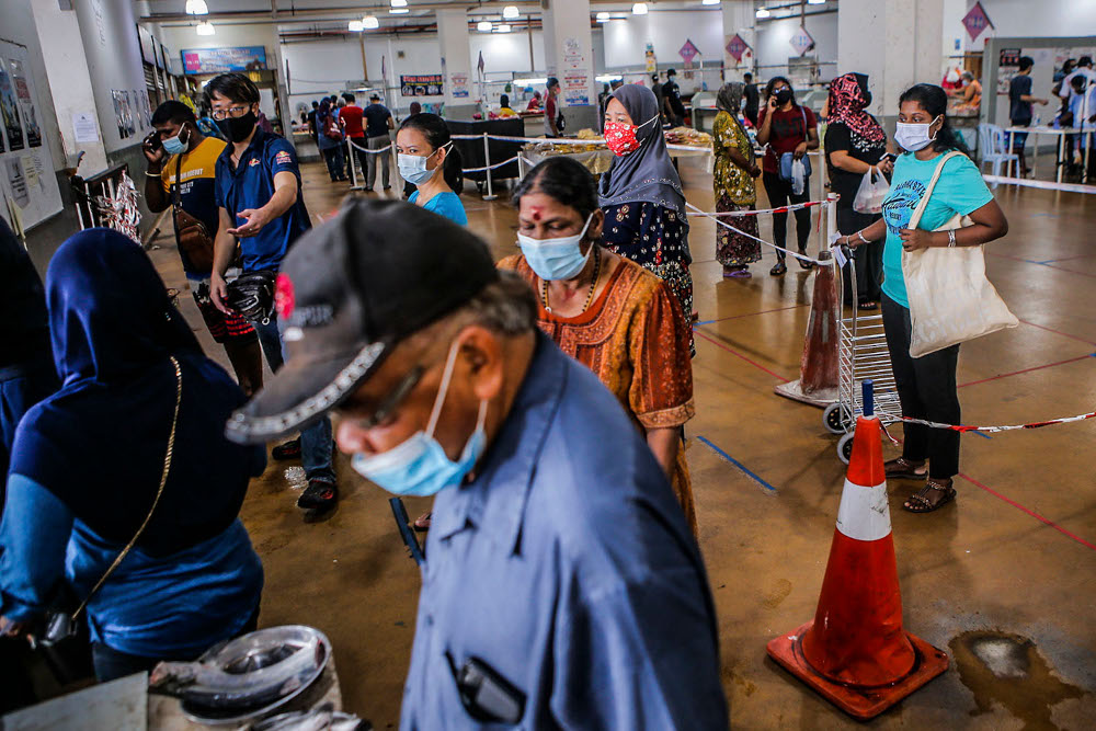 People buying basic needs at the market inside UTC Sentul July 2, 2020. — Picture by Hari Anggara