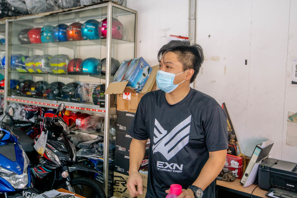 Motorcycle repair shop supervisor Johnny is unsure if the service they sell is considered essential despite having already obtained approval from the Ministry of International Trade and Industries. — Picture by Firdaus Latif