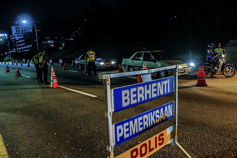 Police and army personnel man a roadblock at KM34 of the Federal Highway in Kuala Lumpur June 2, 2021. u00e2u20acu2022 Picture by Hari Anggara