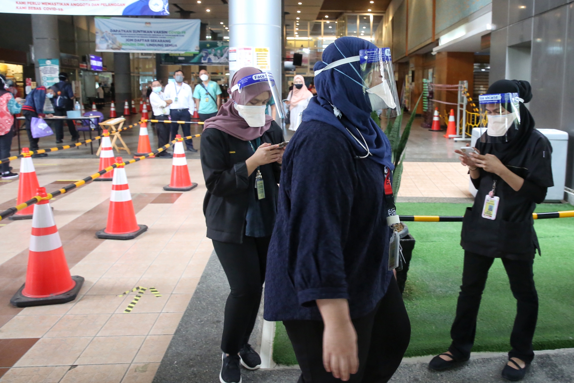 Doctors dressed in black to show support for #HartalContractDoctors are pictured at the Serdang Hospital in Kajang July 26, 2021. — Picture by Choo Choy May