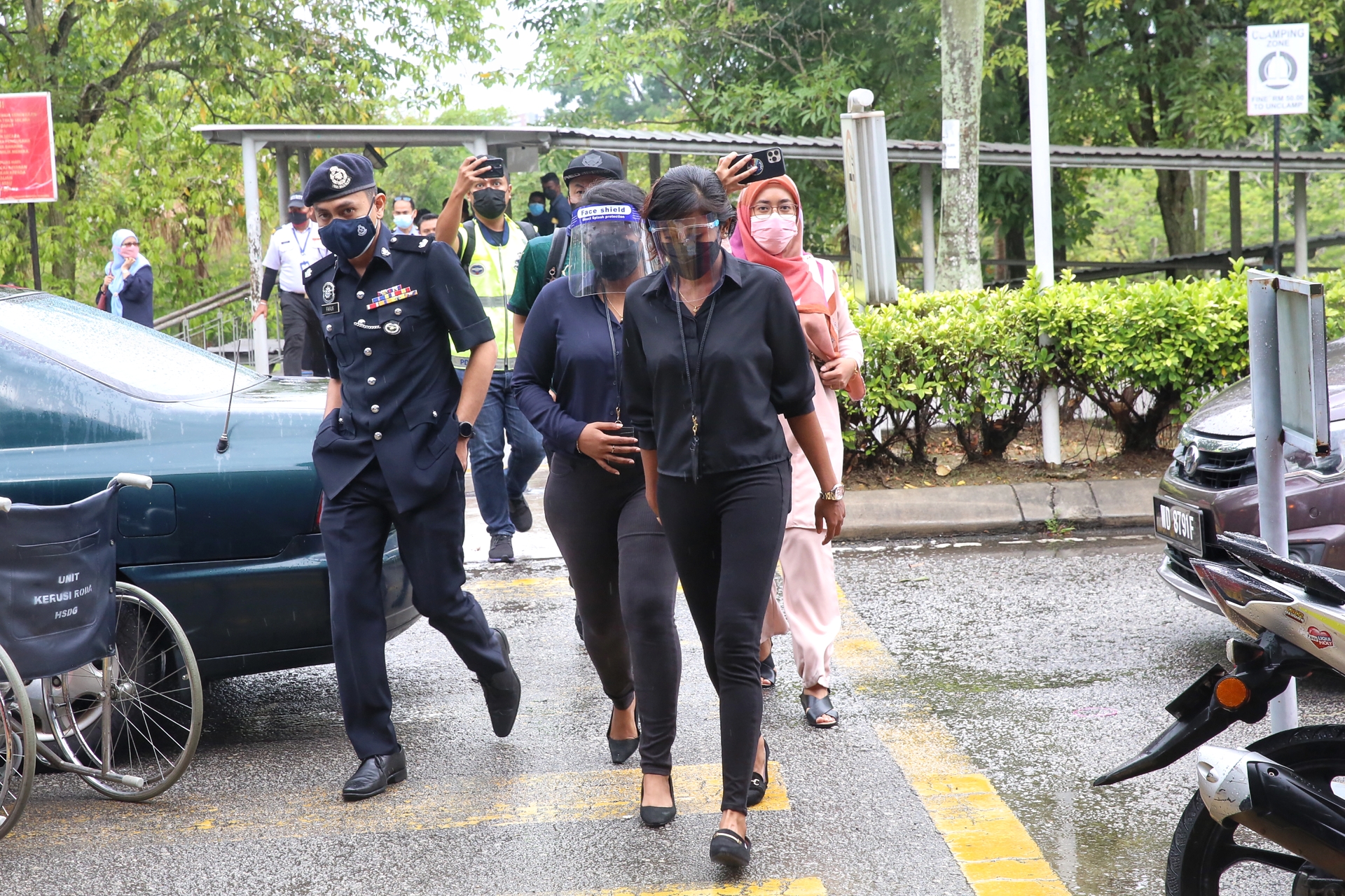 Doctors are seen walking out of the Serdang Hospital in support of #HartalContractDoctors in Kajang July 26, 2021. — Picture by Choo Choy May