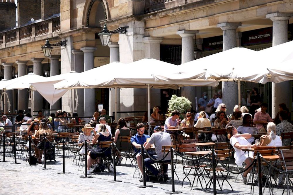 People sit in an outdoor dining area in Covent Garden, amid the coronavirus disease (Covid-19) outbreak, in London, June 15, 2021. u00e2u20acu201d Reuters pic