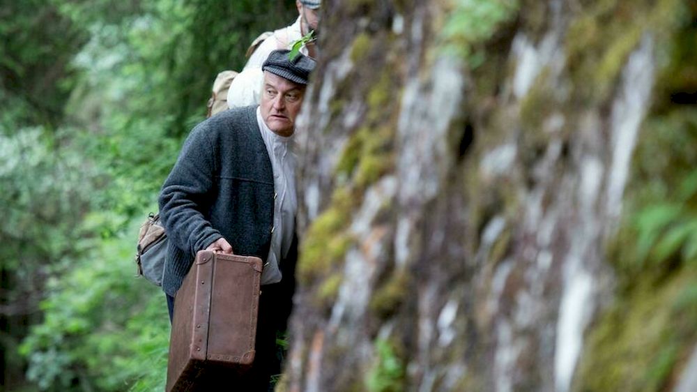 Director, actor and author of the theatre group Teatro Caprile, Andreas Kosek, re-enacts the escape of Jews fleeing Austria after the Holocaust. u00e2u20acu201d AFP pic