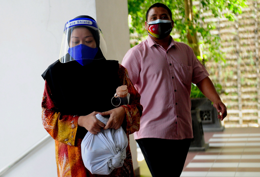 Former journalist Wan Norhayati Wan Alias or better known as Ibu Yati, today pleaded not guilty in the Selangor Syariah High Court to expounding religious doctrines contrary to Islamic law and spreading them through Facebook. u00e2u20acu201d Bernama pic 