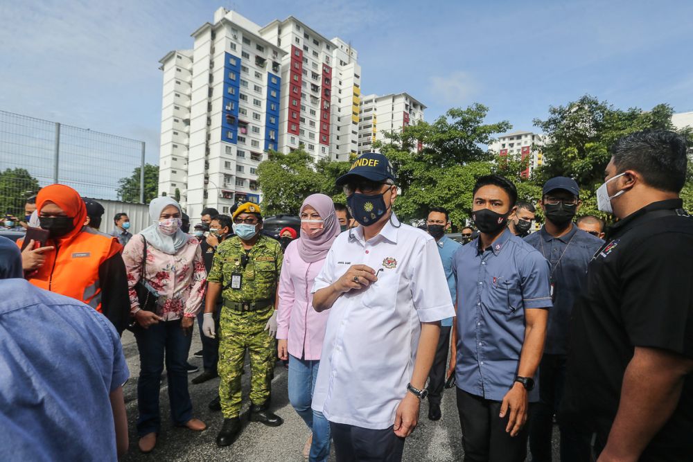 Deputy Prime Minister Datuk Seri Ismail Sabri Yaakob (centre) is pictured during a visit to the Kerinchi PPR in Kuala Lumpur July 11, 2021. u00e2u20acu201d Picture by Yusof Mat Isa