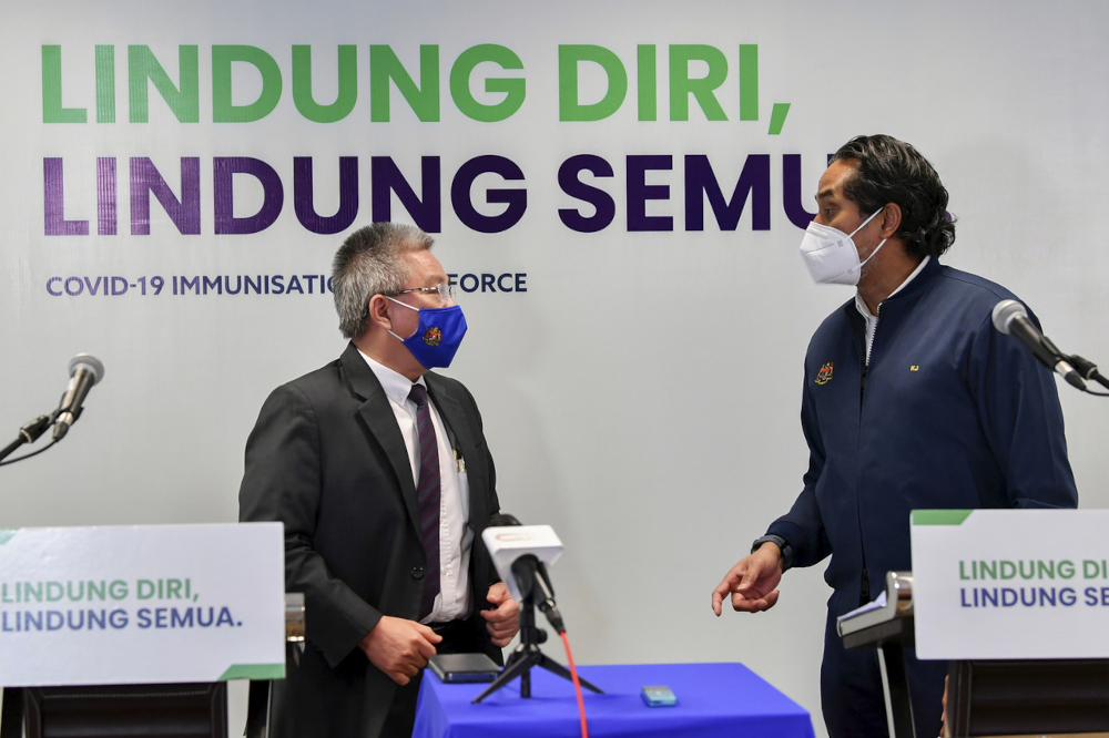 Science, Technology and Innovation Minister Khairy Jamaluddin and Health Minister Datuk Seri Dr Adham Baba at the weekly Covid-19 Immunisation Task Force (CITF) press conference in Putrajaya, July 23, 2021. u00e2u20acu201d Bernama pic 