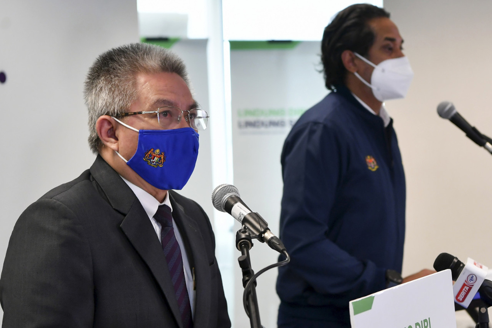 Science, Technology and Innovation Minister Khairy Jamaluddin and Health Minister Datuk Seri Dr Adham Baba at the weekly Covid-19 Immunisation Task Force (CITF) press conference in Putrajaya, July 23, 2021. u00e2u20acu201d Bernama pic 