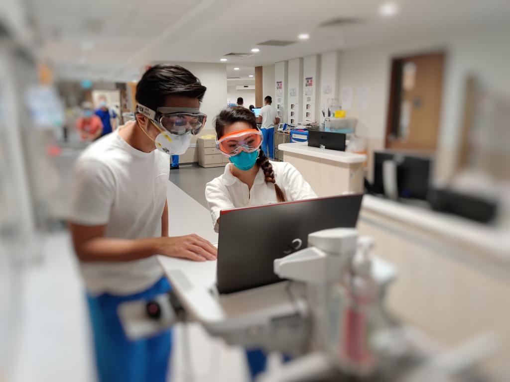 Dr Puah Ser Hon (left), a respiratory physician, and Ms Emelin Tan (right), a senior respiratory therapist, in a ward at the National Centre for Infectious Diseases. u00e2u20acu201d Tan Tock Seng Hospital pic via TODAY