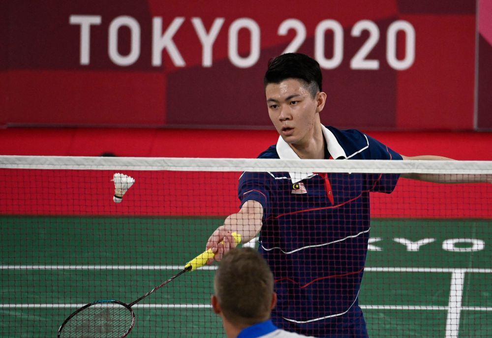 Malaysiau00e2u20acu2122s Lee Zii Jia hits a shot to Franceu00e2u20acu2122s Brice Leverdez in their menu00e2u20acu2122s singles badminton group stage match during the Tokyo 2020 Olympic Games at the Musashino Forest Sports Plaza in Tokyo July 28, 2021. u00e2u20acu201d AFP pic 