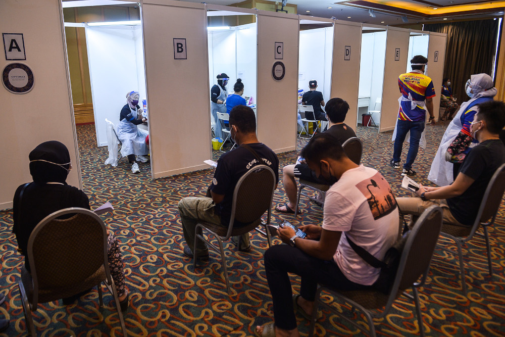 People taking the Covid-19 jab during the launch of the Prihatin vaccination service at Grand Seasons Hotel July 15, 2021. u00e2u20acu201d Picture by Miera Zulyana