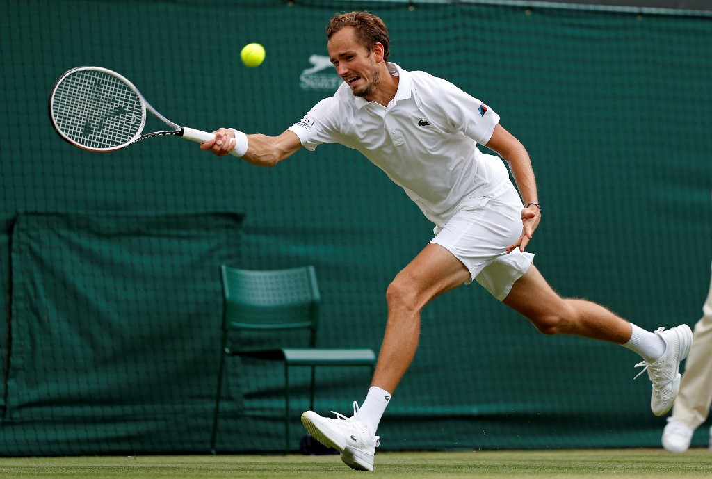 Russiau00e2u20acu2122s Daniil Medvedev returns against Croatiau00e2u20acu2122s Marin Cilic during their menu00e2u20acu2122s singles third round match on the sixth day of the 2021 Wimbledon Championships, July 3, 2021. u00e2u20acu201d AFP pic