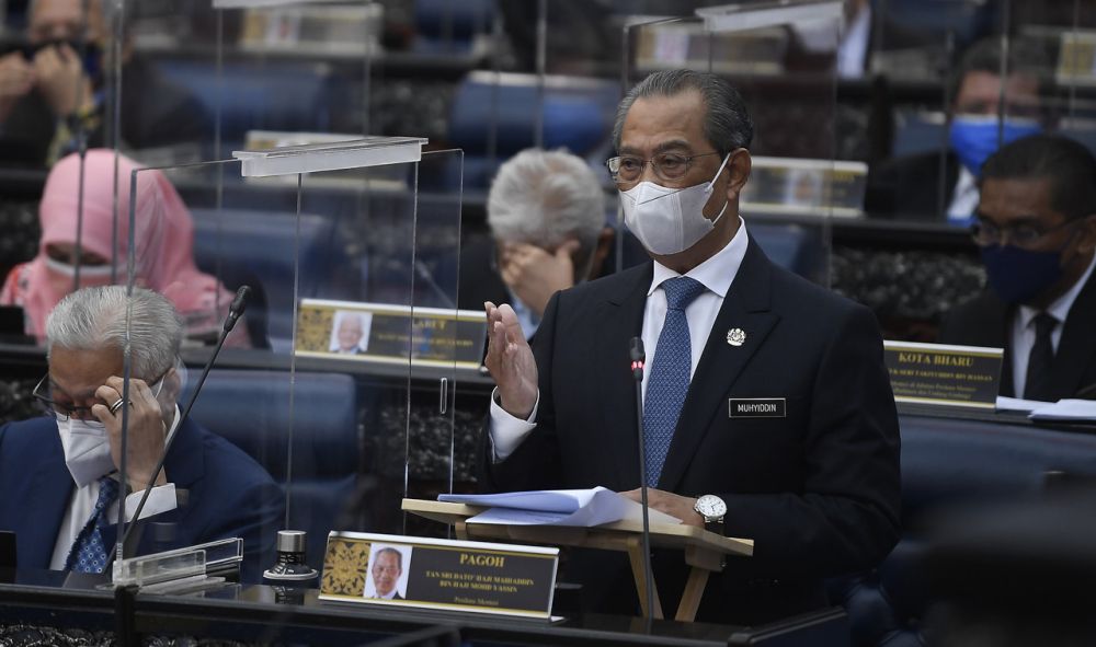 Prime Minister Tan Sri Muhyiddin Yassin delivers his statement on the National Recovery Plan during a special Parliament sitting in Kuala Lumpur July 26, 2021. u00e2u20acu201d Bernama pic