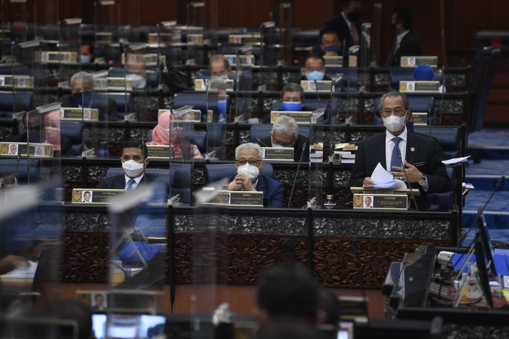 Prime Minister Tan Sri Muhyiddin Yassin delivers his statement on the National Recovery Plan during a special Parliament sitting in Kuala Lumpur July 26, 2021. — Bernama pic