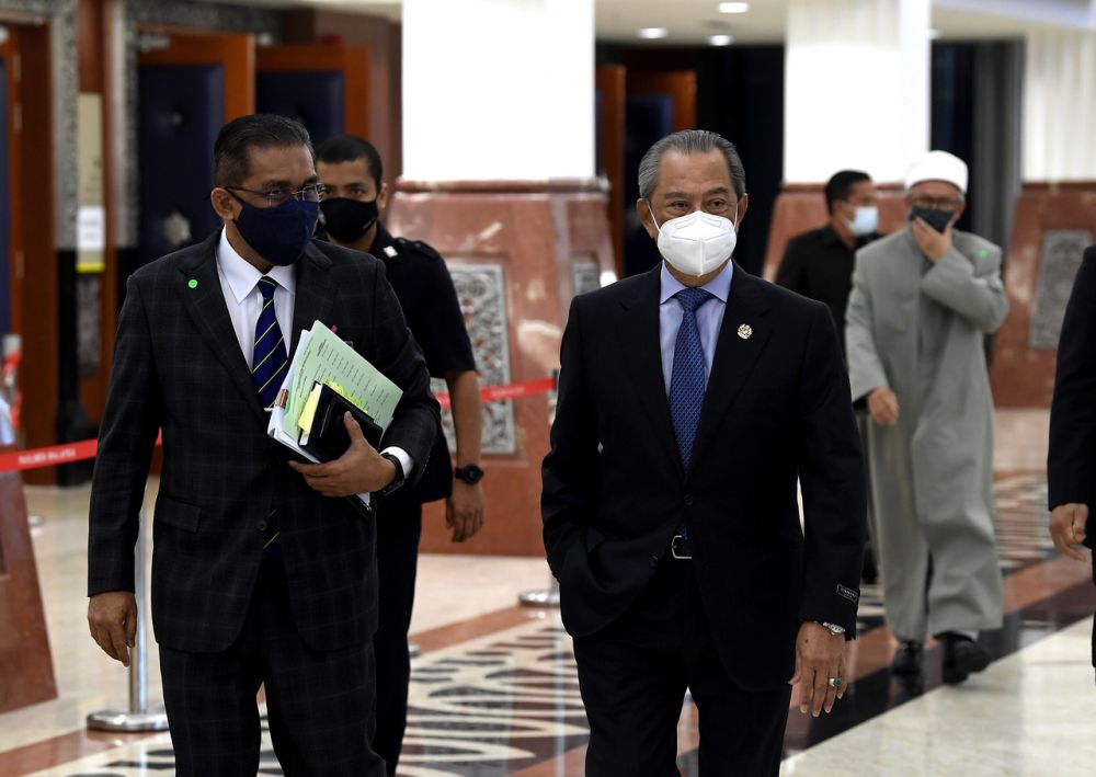 Prime Minister Tan Sri Muhyiddin Yassin and Law Minister Datuk Seri Takiyuddin Hassan are pictured at Parliament, Kuala Lumpur July 27, 2021. u00e2u20acu201d Bernama pic