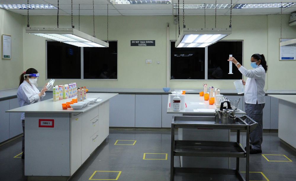 Nestle Malaysia employees observe Covid-19 SOPs by keeping to the one-metre social distancing rule at its Shah Alam plant, July 15, 2021. u00e2u20acu201d Bernama pic 