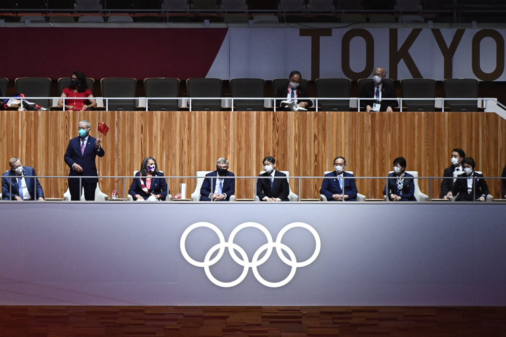IOC Member Zaiqing Yu (2nd left) gestures past (from left) Vice President of the International Olympic Committee (IOC) John Coates, IOC Member Anita DeFrantz, President of the International Olympic Committee (IOC) Thomas Bach, Japan’s Emperor Naruhito (3rd left) attending the opening ceremony of the Tokyo 2020 Olympic Games, at the Olympic Stadium in Tokyo, on July 23, 2021. — AFP pic 