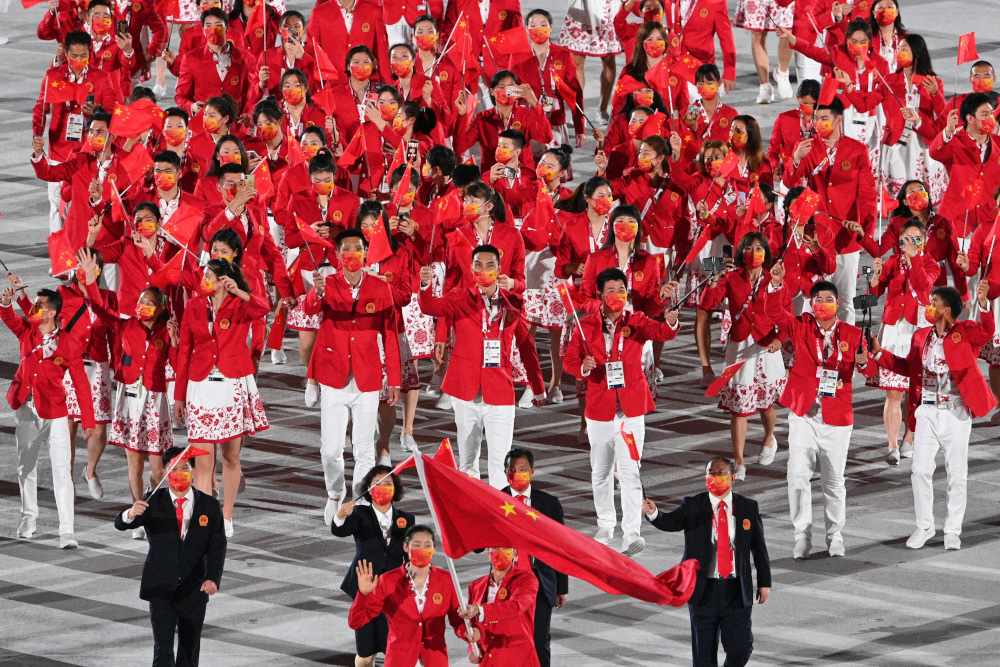 China’s flag bearer Zhu Ting and China's flag bearer Zhao Shuai lead the delegation during the opening ceremony of the Tokyo 2020 Olympic Games, at the Olympic Stadium, in Tokyo, July 23, 2021. — AFP pic 
