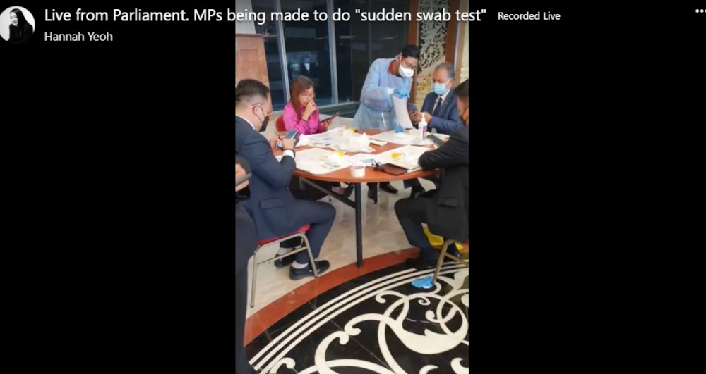 A screengrab of Segambut MP Hannah Yeohu00e2u20acu2122s u00e2u20acu02dcliveu00e2u20acu2122 Facebook video broadcast show several lawmakers taking the Covid-19 swab test at Parliament lobby, July 29, 2021. u00e2u20acu201d Screengrab from Facebook/Hannah Yeoh 