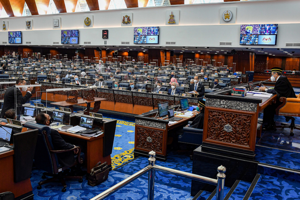 Members of Malaysiau00e2u20acu2122s parliament attend a session of the lower house of parliament, in Kuala Lumpur, Malaysia July 26, 2021. u00e2u20acu201d Malaysia Information Department/Nazri Rapaai handout pic via Reuters 