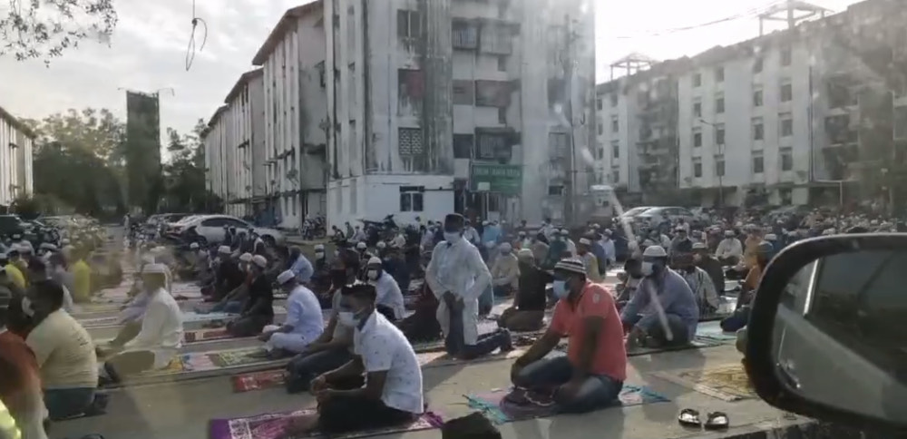 A crowd of around 200 people performing Aidiladha prayers outside a surau in Juru, Penang July 20, 2021. u00e2u20acu201d Video screencap from social media
