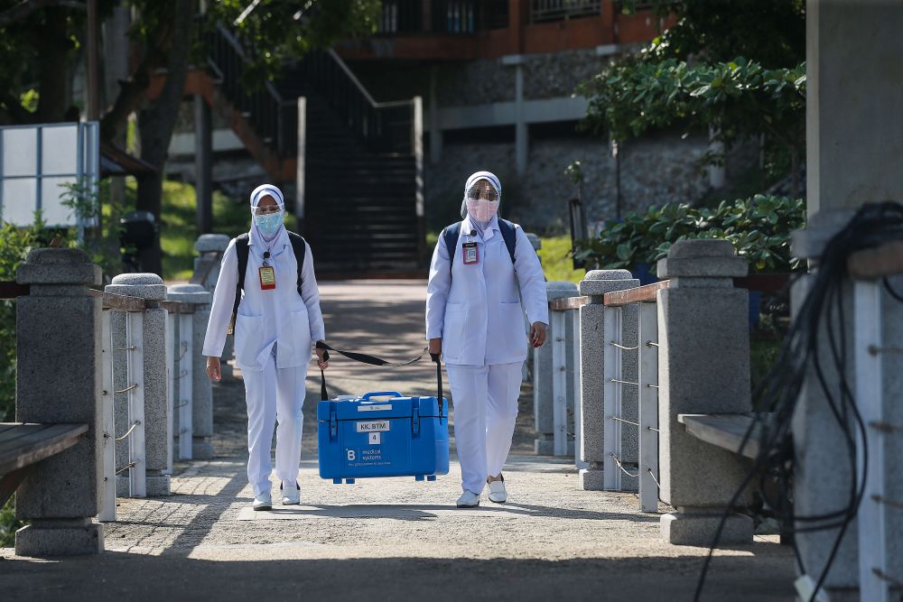 Health personnel arrive at Pulau Aman with Covid-19 vaccines as part of the south Seberang Perai health district's mobile outreach programme July 8, 2021. u00e2u20acu201d Picture by Sayuti Zainudin