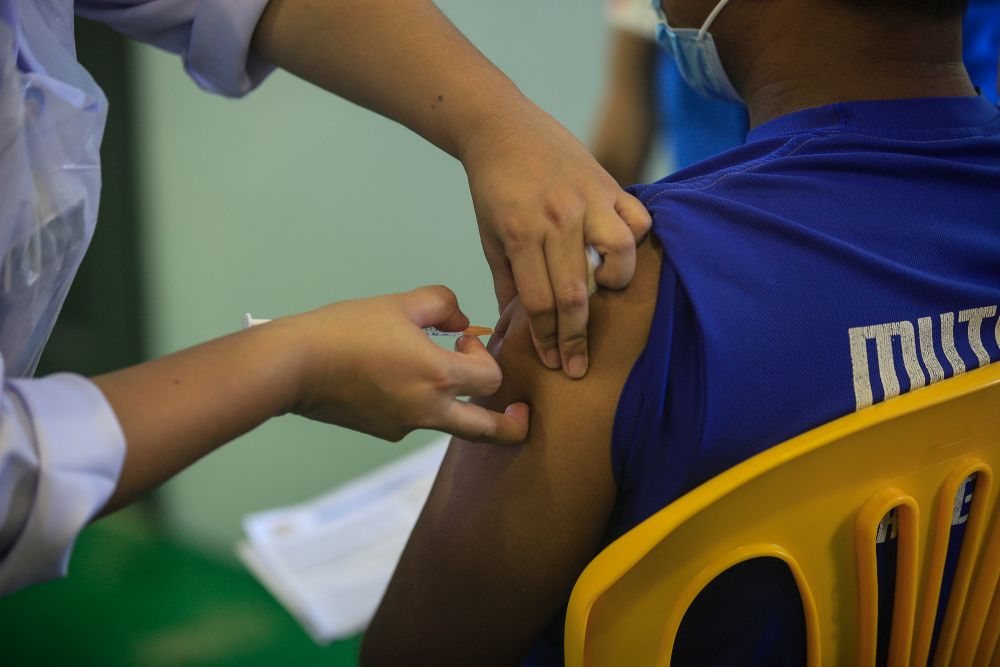 Pulau Aman residents receive their Covid-19 jabs as part of the south Seberang Perai health district's mobile outreach programme in Pulau Aman July 8, 2021. u00e2u20acu201d Picture by Sayuti Zainudin