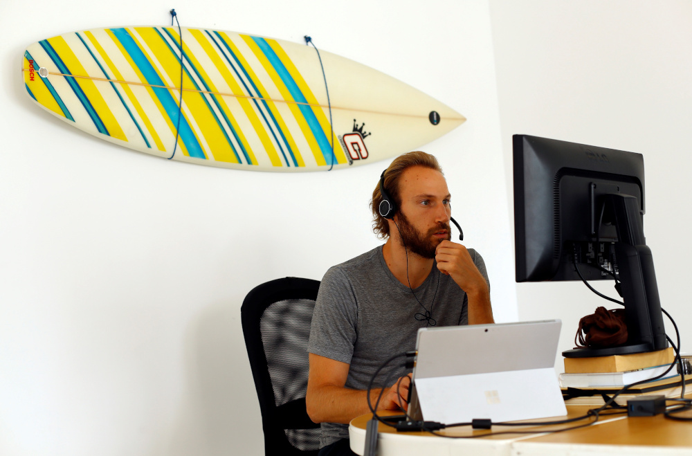 Alex Swaton, 30, from United States, works remotely from Las Palmas De Gran Canaria, amid the coronavirus disease (Covid-19) outbreak, in Gran Canaria, Spain July 23, 2021. — Reuters pic