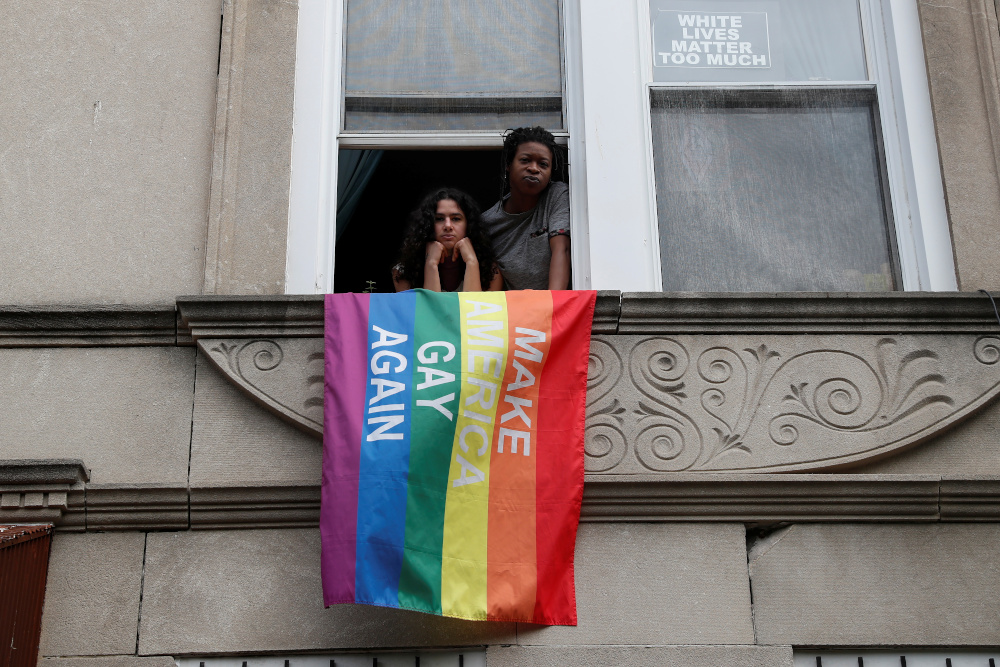 Elsa Eli Waithe and Ada Reso, u00e2u20acu02dcSlavers of New Yorku00e2u20acu2122 campaign co-founders, pose at a windowsill in the Bedford-Stuyvesant section of the Brooklyn borough of New York May 24, 2021. u00e2u20acu201d Reuters pic