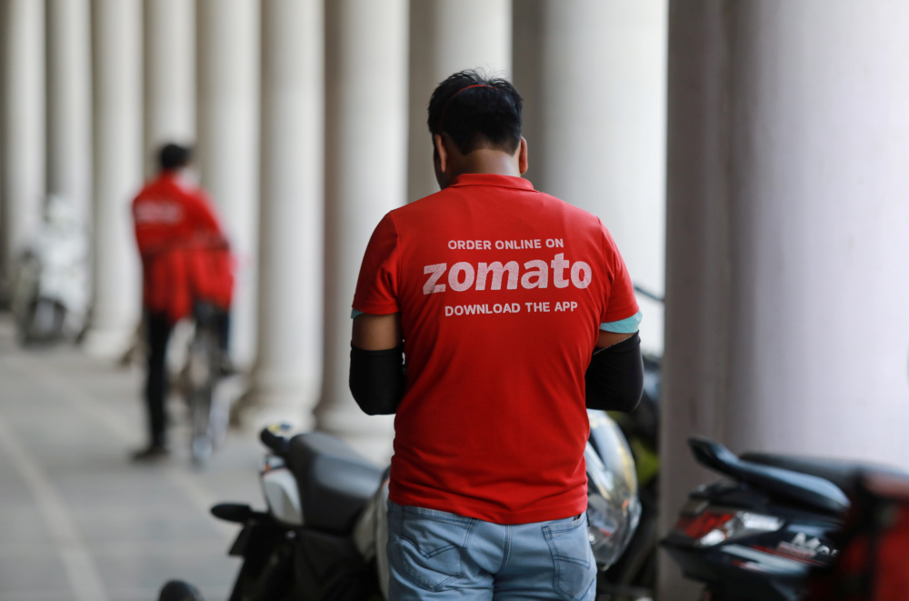 A delivery worker of Zomato, an Indian food-delivery startup, waits to collect an order from a restaurant in New Delhi May 21, 2020. u00e2u20acu201d Reuters pic