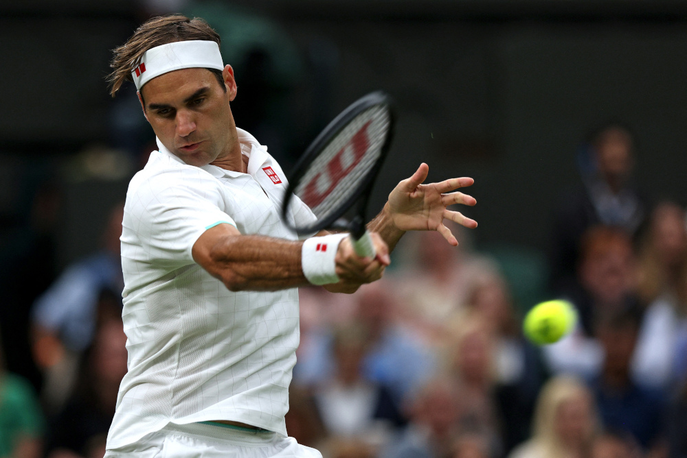Switzerlandu00e2u20acu2122s Roger Federer returns against Franceu00e2u20acu2122s Adrian Mannarino during their menu00e2u20acu2122s singles first round match of the 2021 Wimbledon Championships at The All England Tennis Club in Wimbledon, London, June 29, 2021. u00e2u20acu201d AFP pic 