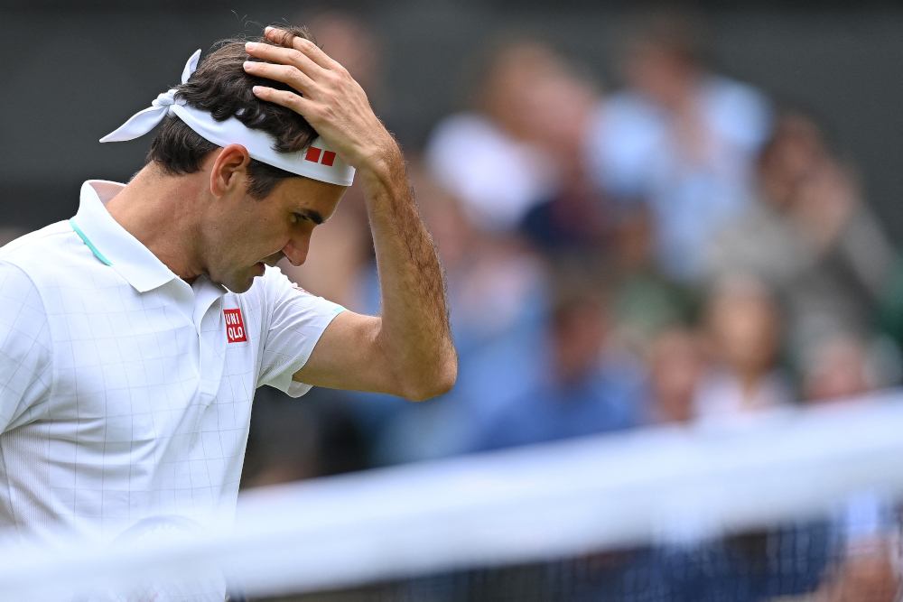 Switzerlandu00e2u20acu2122s Roger Federer reacts against Polandu00e2u20acu2122s Hubert Hurkacz during their menu00e2u20acu2122s quarter-finals match of the 2021 Wimbledon Championships at The All England Tennis Club in Wimbledon, July 7, 2021. Hurkacz won the match. u00e2u20acu201d AFP pic 