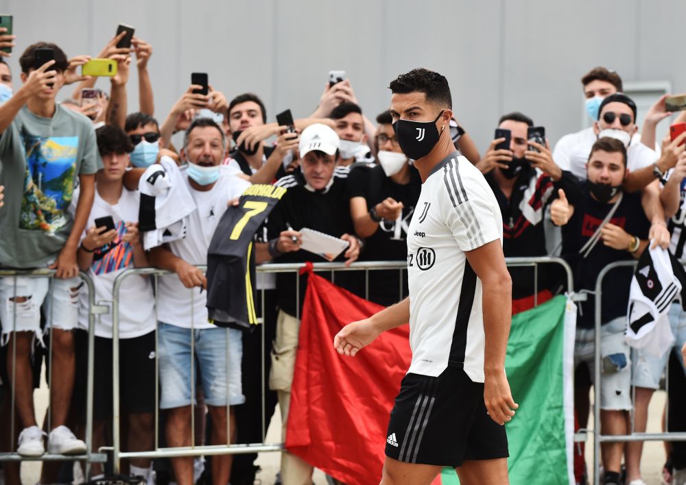 Juventus' Cristiano Ronaldo wearing a protective face mask as he arrives at Juventus medical centre while fans look on in Turin July 26, 2021. u00e2u20acu201d Reuters pic