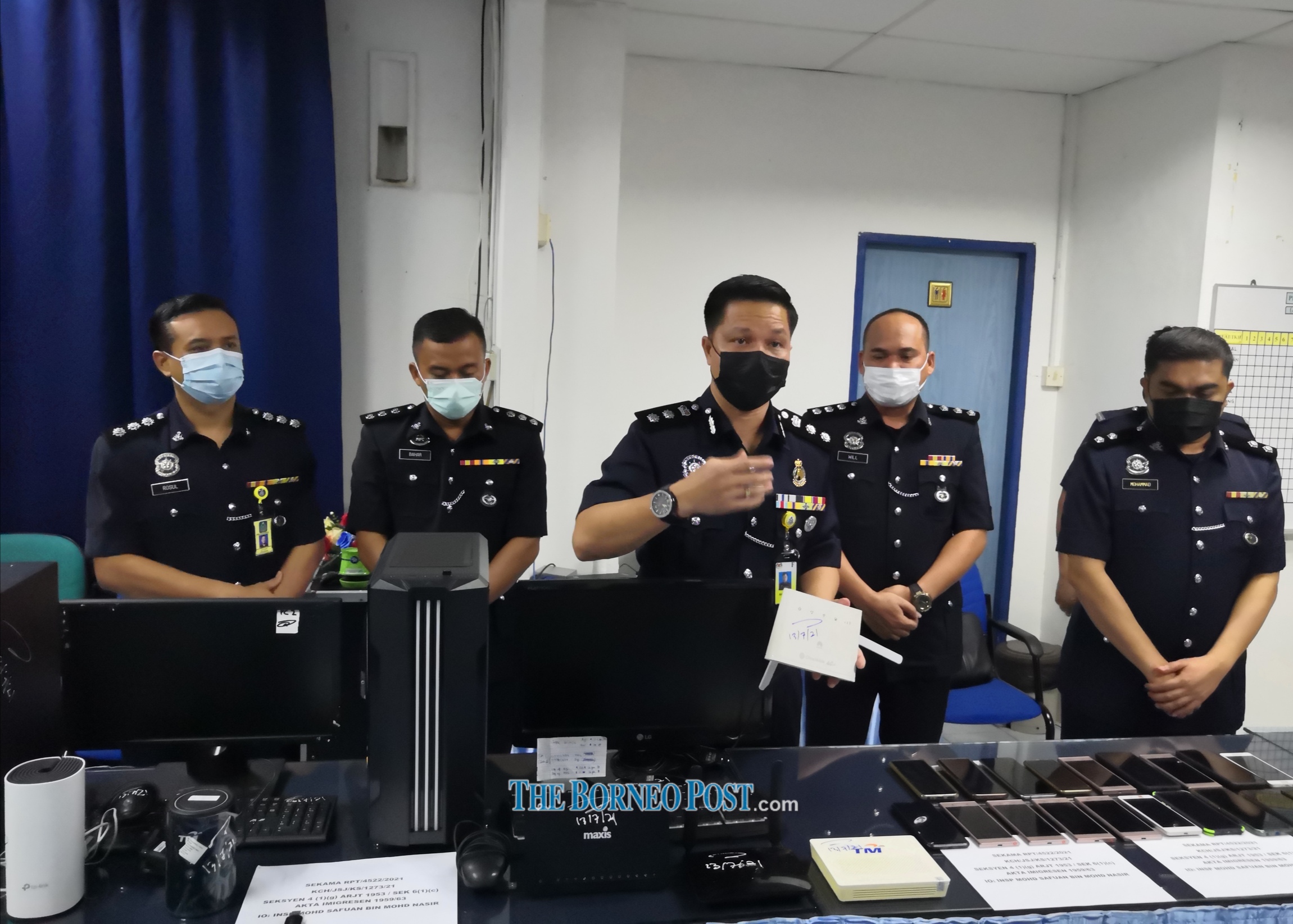 Kuching police chief ACP Ahsmon Bajah shows the equipment seized during the raids. u00e2u20acu2022 Borneo Post pic